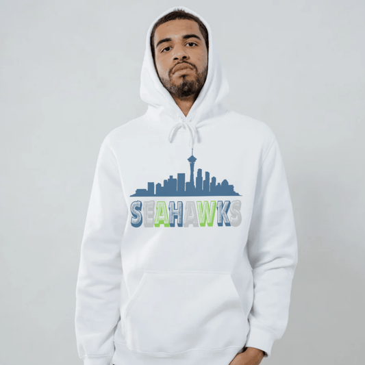 Person wearing a white hoodie with 'Seahawks' design with city skyline